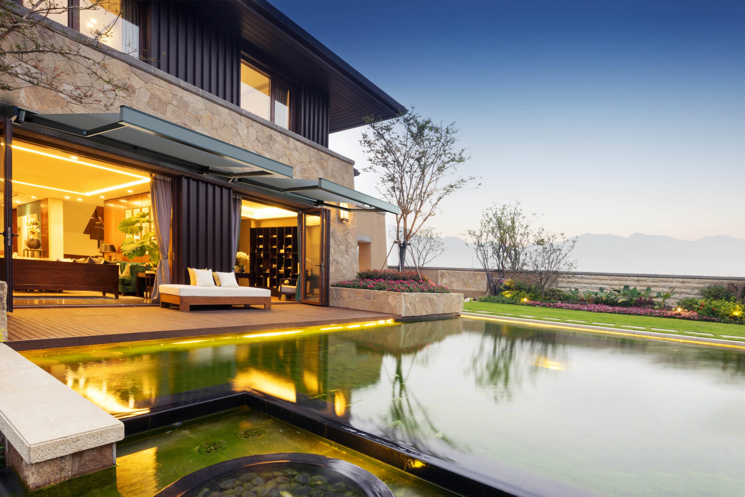 exterior of modern building near pond at twilight