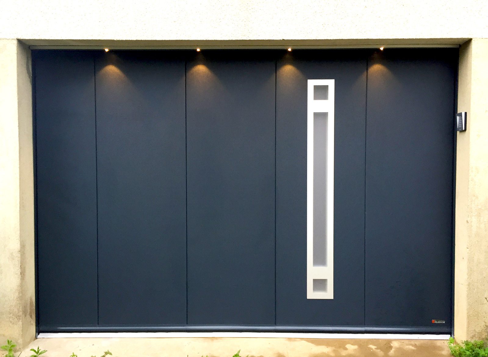 Porte de garage coulissante latérale